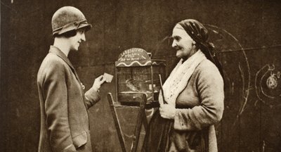 An old Italian woman with a parakeet in a cage, from Wonderful London, published 1926-27 by English Photographer